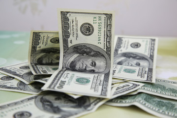 A pile of hundred dollar bills