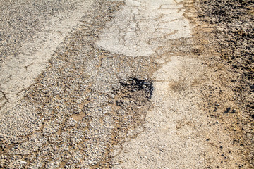 Cracks on the asphalt as background