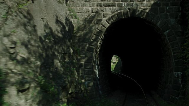 A on board shot of a train passing thourgh a rocky area