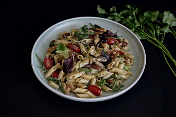 pasta salad dish on dark background 