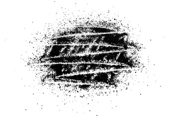 Abstract pattern of black powder on white background
