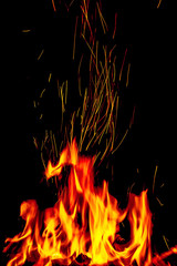Fototapeta na wymiar Fire with sparks on a black background