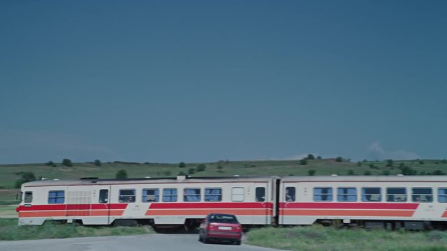 A video of an old red and white colored train.
