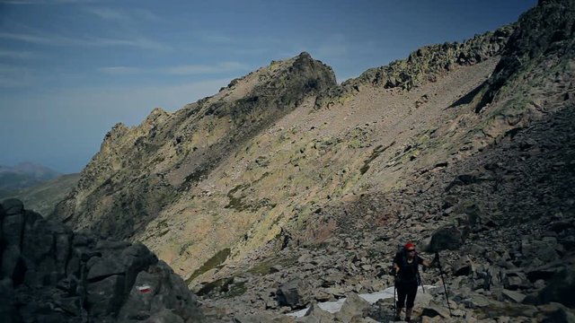 Young woman on trekking trip in Corsica. Inspirational mountains landscape, adventure and expedition concept.