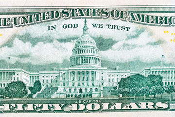 close-up 50 US dollar bills with in God we trust text. Background