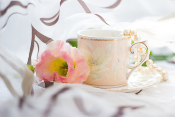 Fototapeta na wymiar Flowers and coffee cup