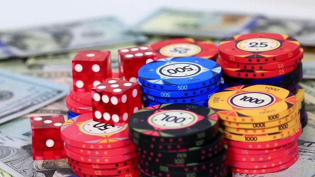 US dollar and dice and casino chip