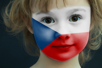 Child with a painted flag of Czech Republic