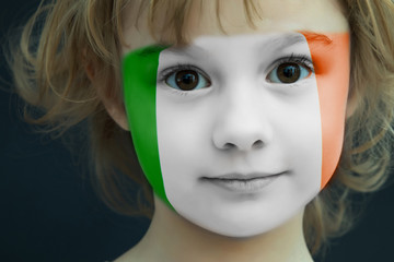 Child with a painted flag of ireland