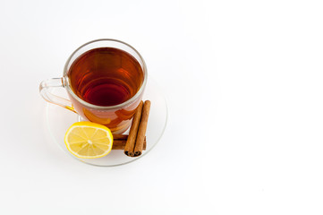 Tea cup with lemon and cinnamon isolated on white background.