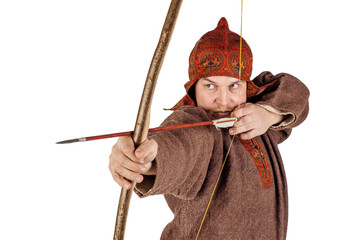 medieval slavic soldier in historical costume holding a bow and arrow. image on white studio...