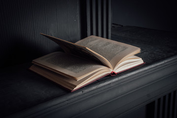 living room decor elemens: candlestick, fireplace and books