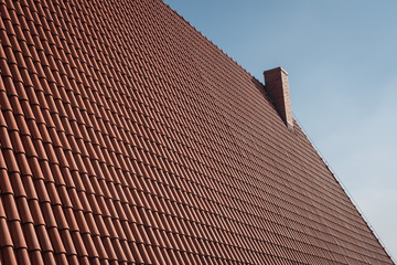 Roof with traditional polish tile and chimney