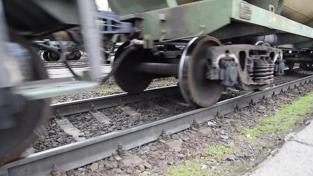 Movement of a freight train. Tanks on rails. Wheels of the train.