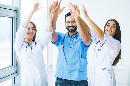 Group Of Medical Workers Working Together In Hospital