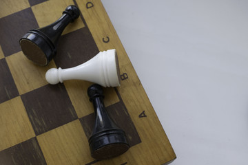 Chess and wooden chessboard , close up. Space for text.