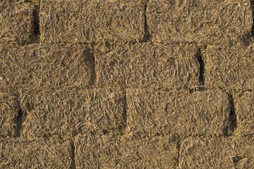 The clay walls of the house. Masonry from adobe.