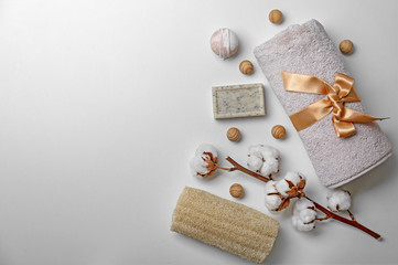 Composition with spa cosmetics, accessories and cotton flowers on white background