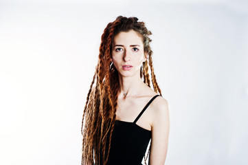 Studio shoot of girl in black with dreads on white background.