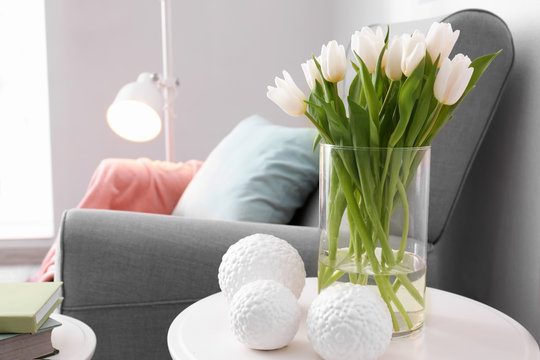 Small Table With Bouquet Of Tulips And Decor In Living Room