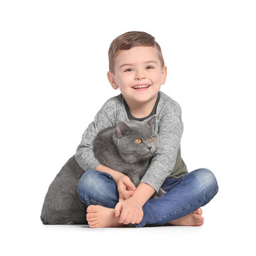 Cute little child with cat on white background