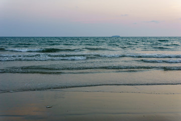 panorama landscape view of seascape and skyline with sun over the sea between the island and amazing twilight in the evening.