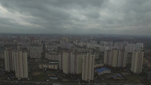 Aerial drone footage of gray dystopian urban area with identical houses