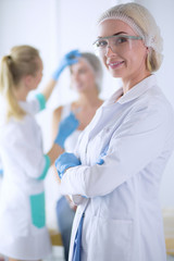 Beautiful woman face near doctor with syringe