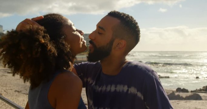 Couple kissing each other at beach 