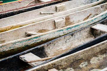 traditional wooden canoe boats closeup - paddle boat concept