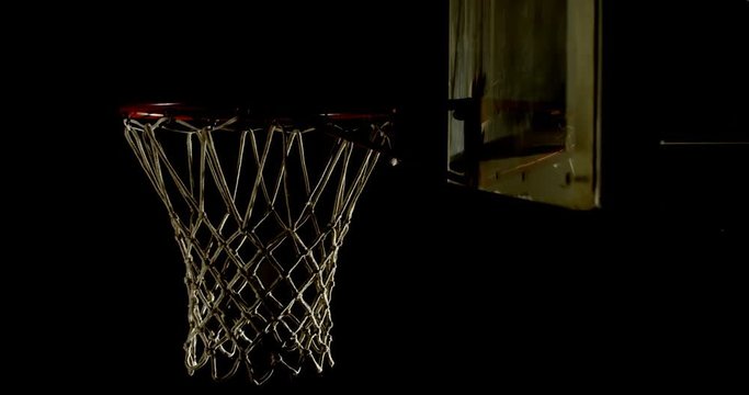 Basketball being thrown in basketball hoop 