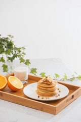 Breakfast. Banana pancakes with honey and nuts