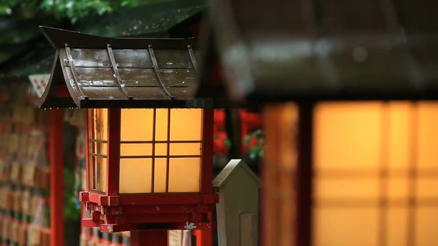 Japanese temple lanterns in rainy weather.