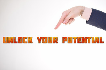 A businessman shows an inscription:UNLOCK YOUR POTENTIAL