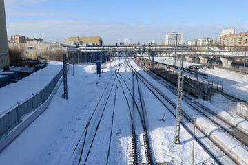 small railway station in the city on a clear winter day