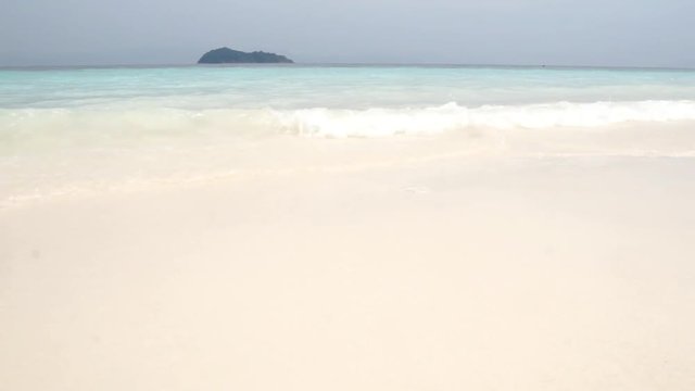 Low Angle Camera Movement On White Sand Beach With Crystal Clear Blue Andaman Sea At Border Thailand And Myanmar.