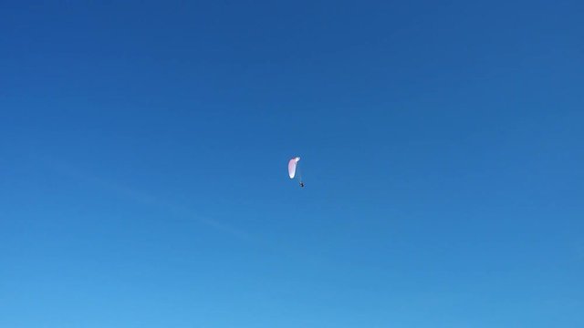 Powered paragliding ppg flying high in beautiful blue sky
