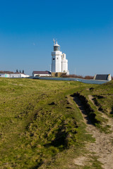 Fototapeta na wymiar St Catherine's Lighthouse on Isle of Wight at Watershoot Bay in England