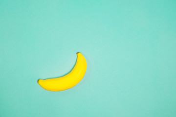 Single banana on color background., From top view.