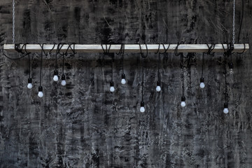 Idea concept: on light bulbs in front of empty blackboard