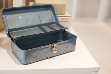 blue metal toolbox on white desk