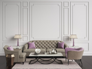 Classic interior in beige and pink colors.Sofa,chairs,sidetables with lamps,table with decor.White color walls with mouldings