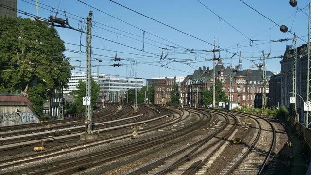 Time lapse of many trains approaching and passing by in Hamburg Germany