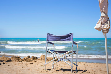 Fototapeta na wymiar Folding sea chair on the beach in relax day