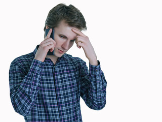 Closeup portrait of young, serious business man, corporate employee, student talking on cell phone.