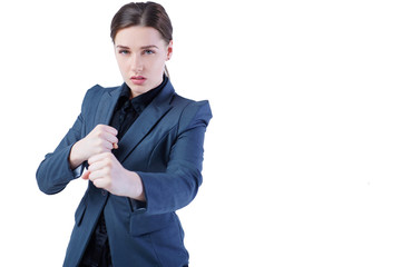 Young caucasian business woman in full length, ready for a fight isolated on white background.