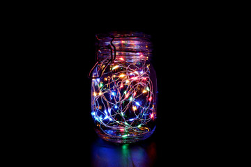 Colorful Fairy Light in a Glass Jar, in the Dark, Low-Key Photography