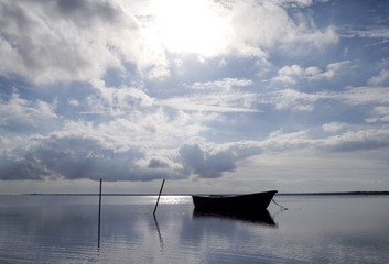 Laesoe / Denmark: Small fishing boat in the bay at Bloeden Hale