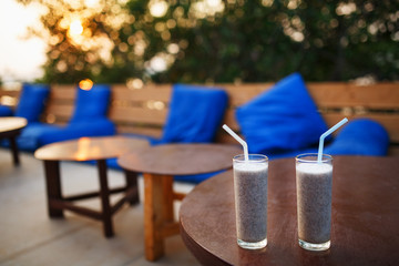 Cocktails on a sea front bar whilst the sun is setting