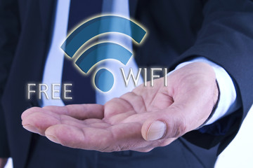 businessman holding wi-fi icon in hand. network and internet concept